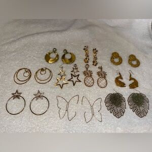 10 pair of gold tone earrings.